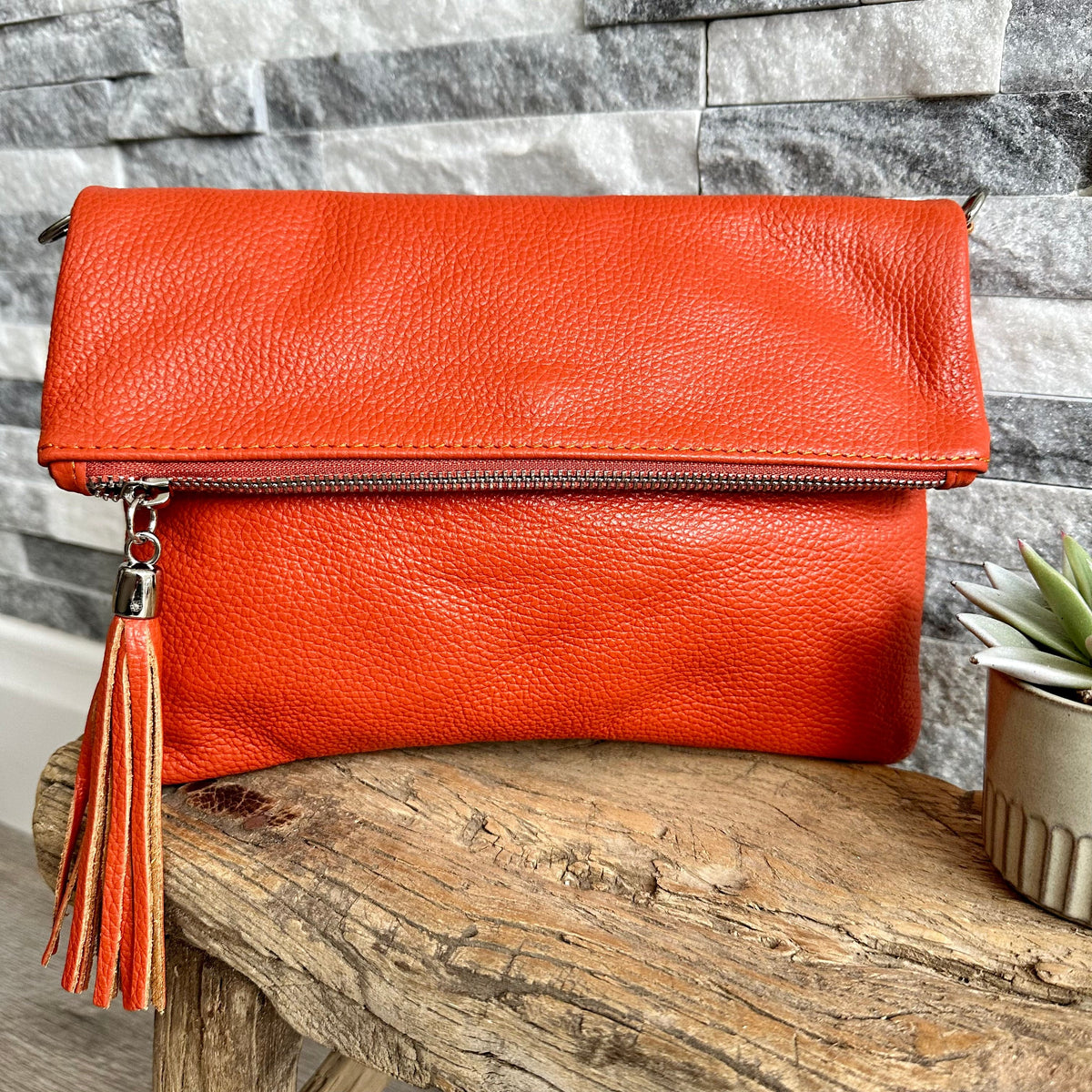 Etul top bags London orange leather woman’s clutch bag