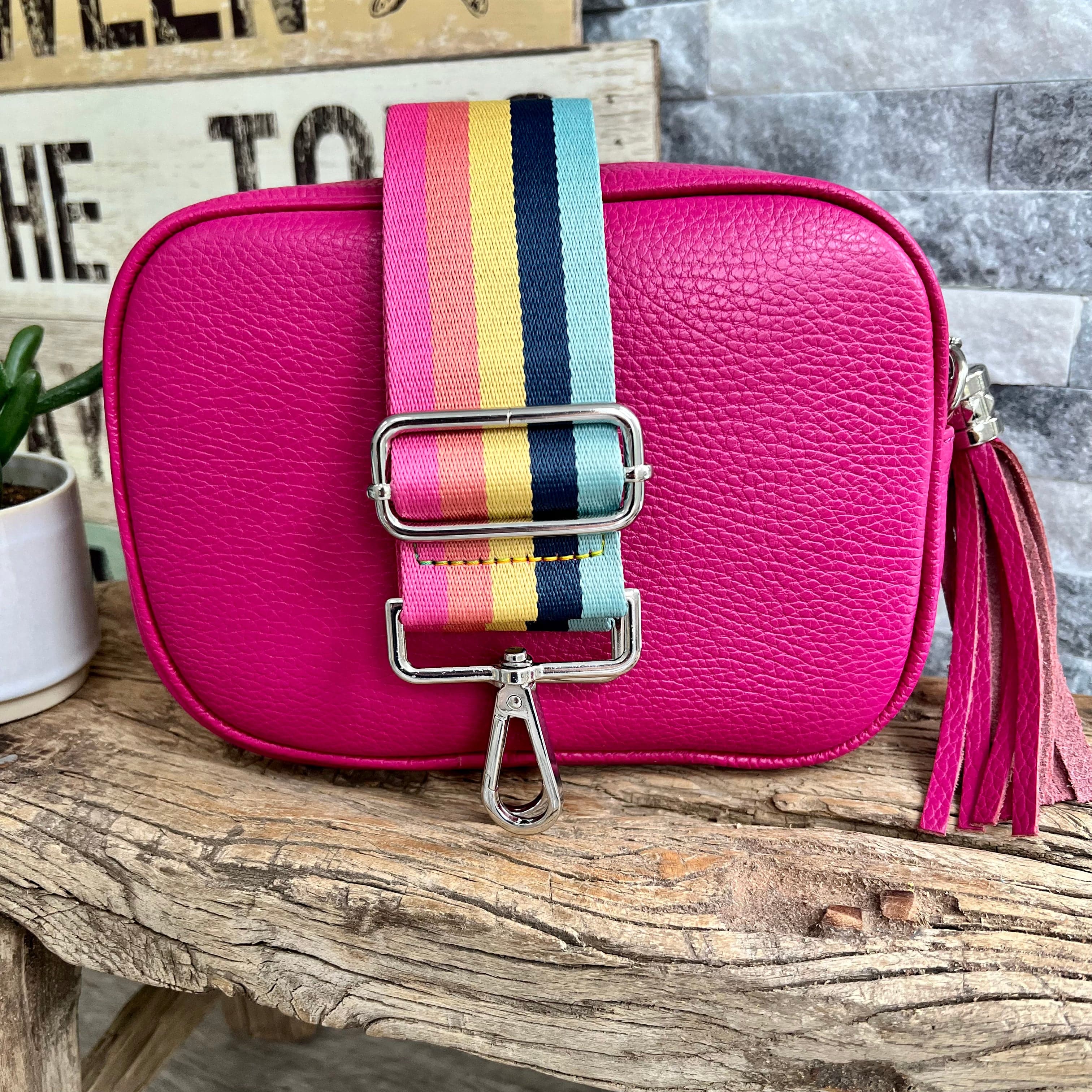 https://www.lusciousscarves.com/cdn/shop/files/lusciousscarves-guitar-straps-hot-pink-italian-leather-camera-style-crossbody-bag-with-wide-strap-combo-31140568891582.heic?v=1682505006